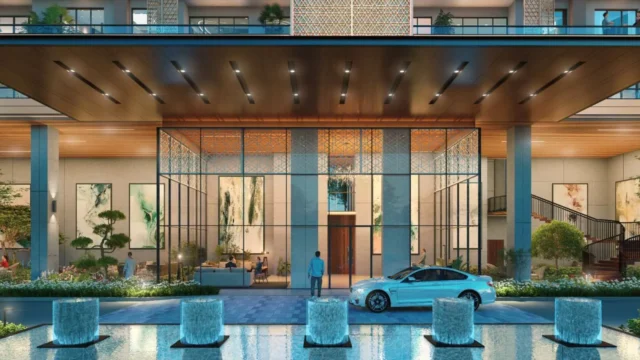 Double-height entrance lobby with water fountains at Puri Diplomatic Residences
