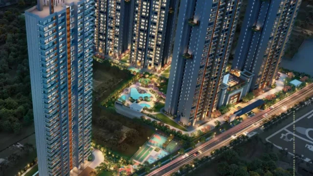 Aerial night view of Signature Global Cloverdale SPR high-rise towers in Sector 71 Gurugram