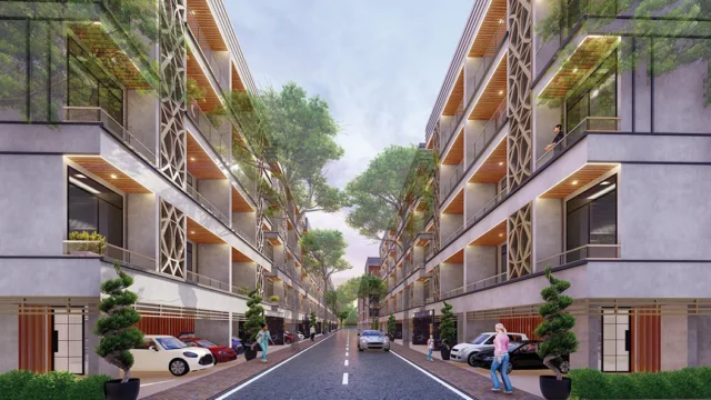 Street-level view of MRG Crown low-rise 3 BHK floors with greenery and facade lighting