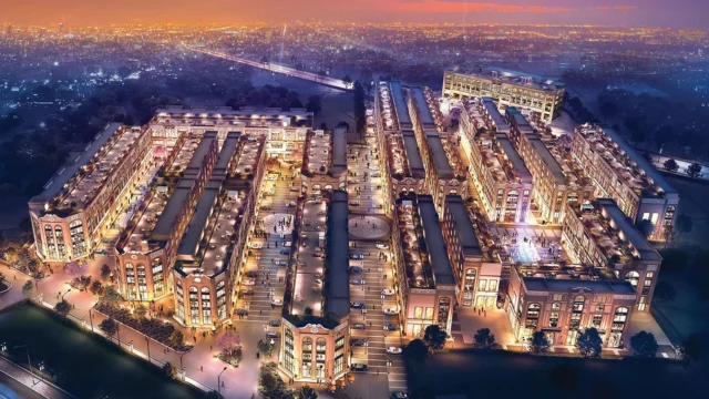 Aerial night view of Spaze Grand Central 114 Gurgaon with well-planned SCO layout and illuminated streets