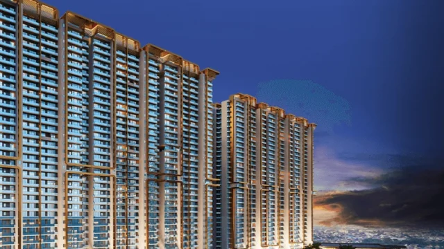 M3M Mansion high-rise towers and golf greens at dusk