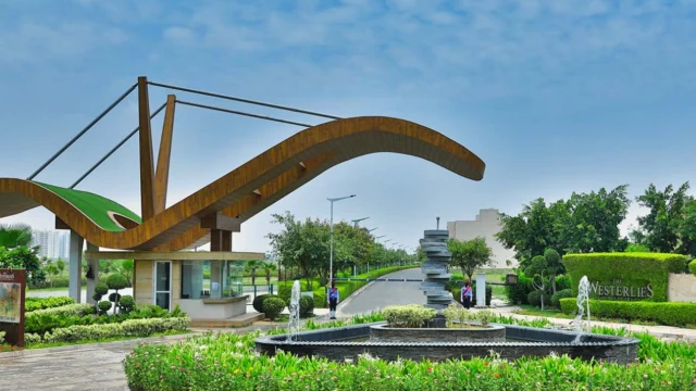 Grand entrance of Experion The Westerlies with iconic wooden canopy and lush landscaping, Sector 108 Gurgaon