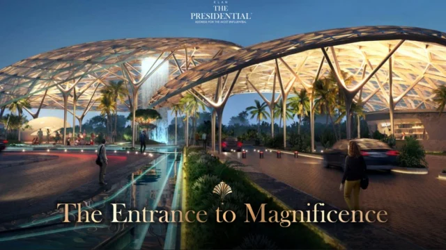 Grand illuminated entrance of Elan The Presidential with iconic canopy and water features