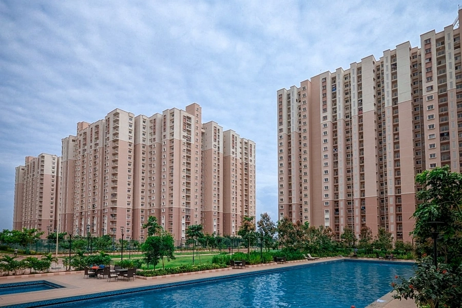 High-rise residential towers of Ashiana Aaroham with landscaped gardens and swimming pool
